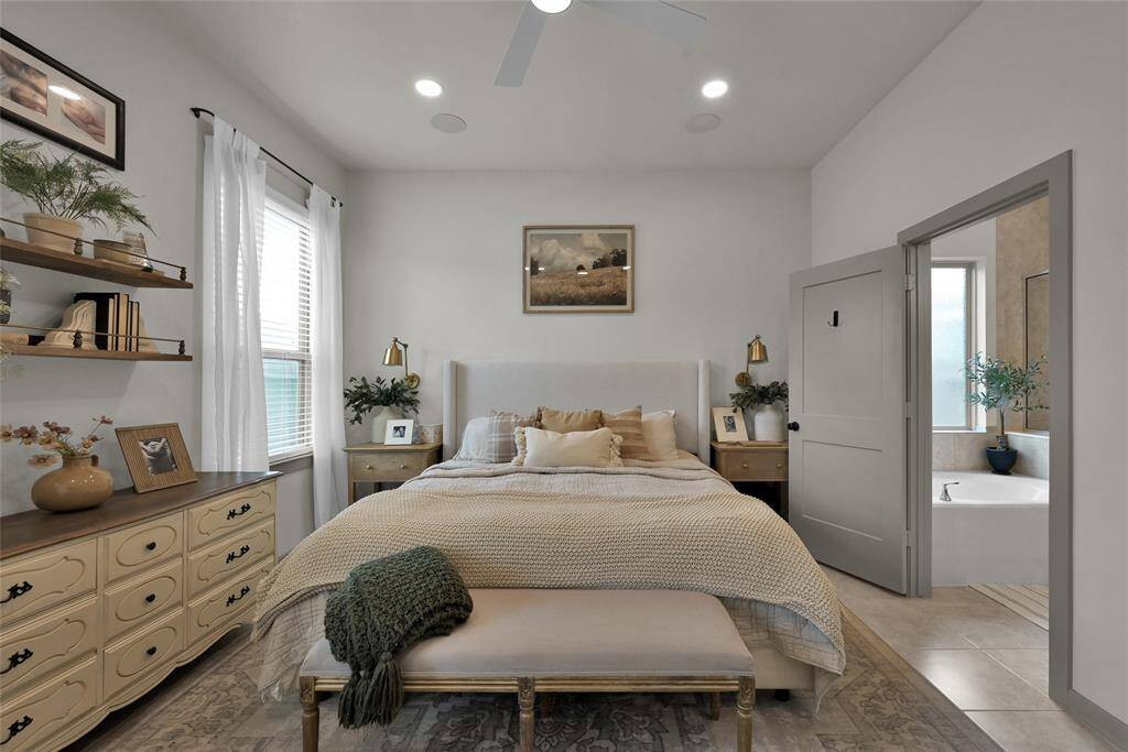 The Primary Bedroom offers a ceiling fan for comfort, upgraded fixtures,and a serene atmosphere ideal forrelaxation.
