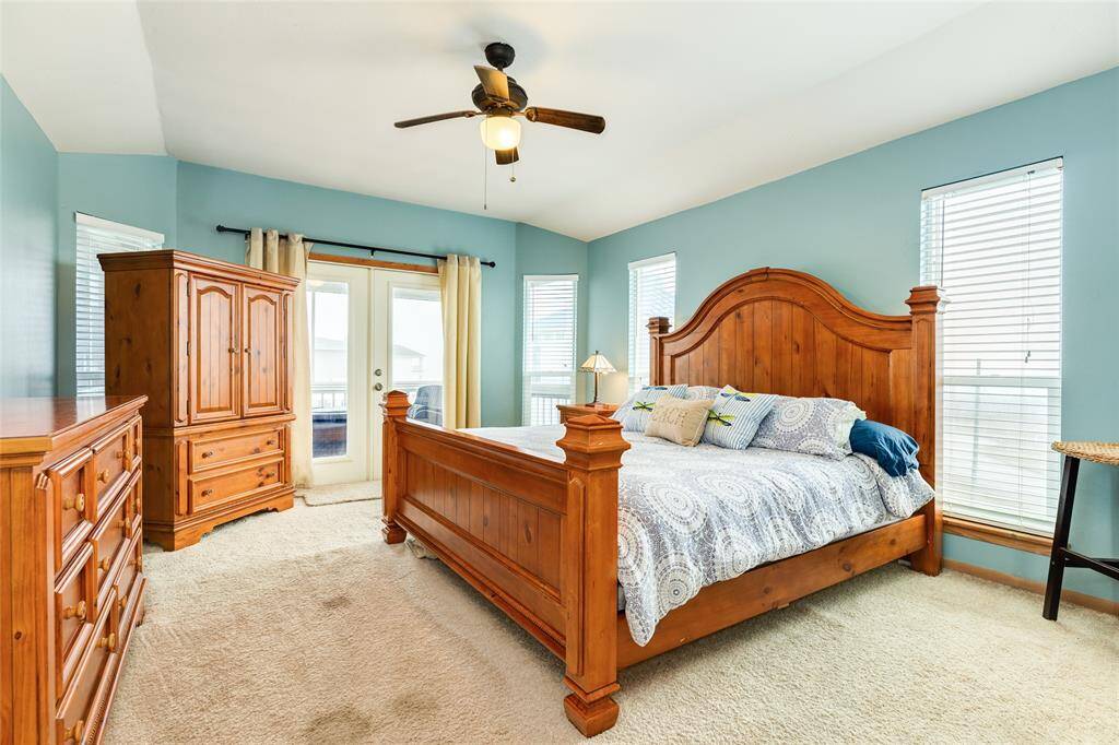 Primary bedroom is upstairs and has a private screened-in porch
