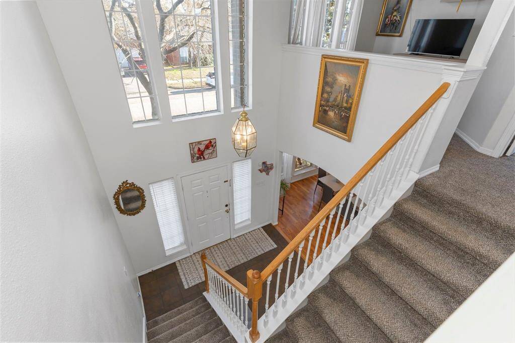 Check out the stunning tall custom window! Let’s head upstairs and see what awaits!
