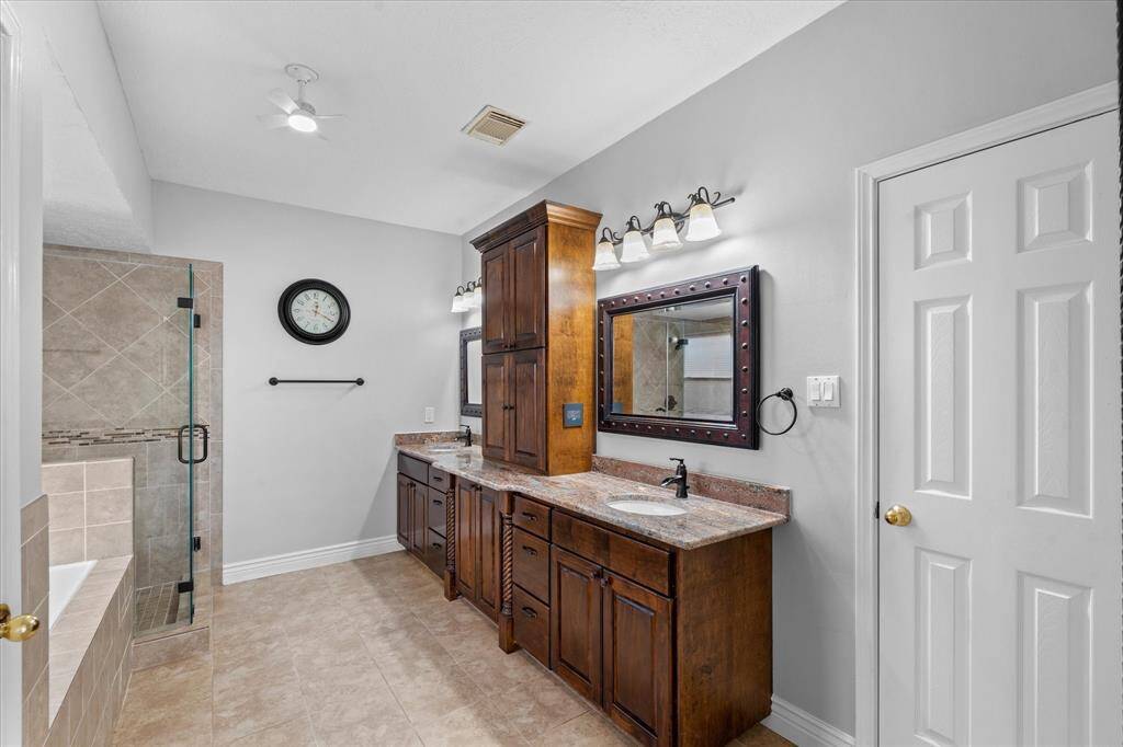 Primary bathroom with two sinks.