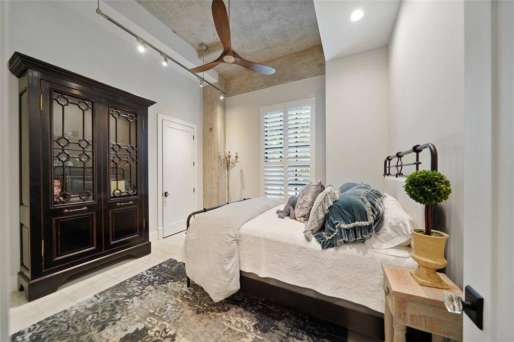 This versatile 13 x 13 secondary bedroom can serve as a luxurious guest suite with an ensuite bath and walk-in closet, or transform into a spacious home office.