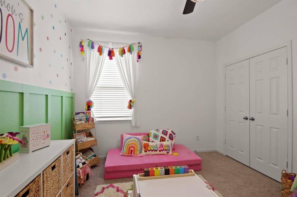 Another view of this 2nd bedroom, with lots of natural light streaming in.