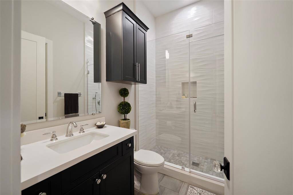 The Secondary full bath serves both the secondary bedroom and the guests