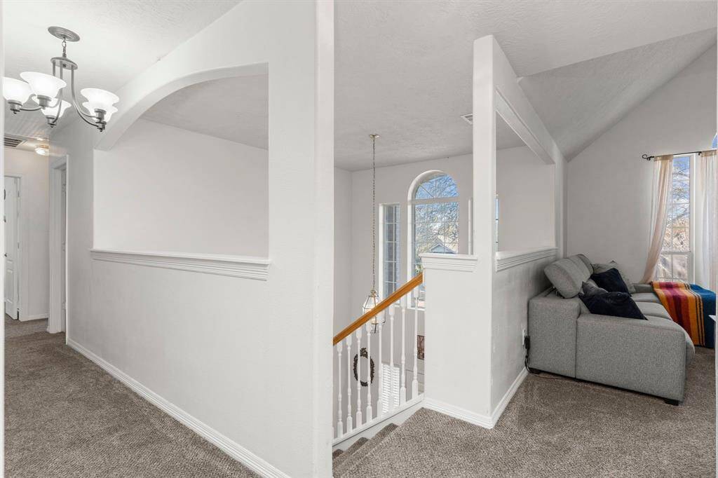 Down the hallway, you’ll find the bedrooms thoughtfully tucked away for added privacy!
