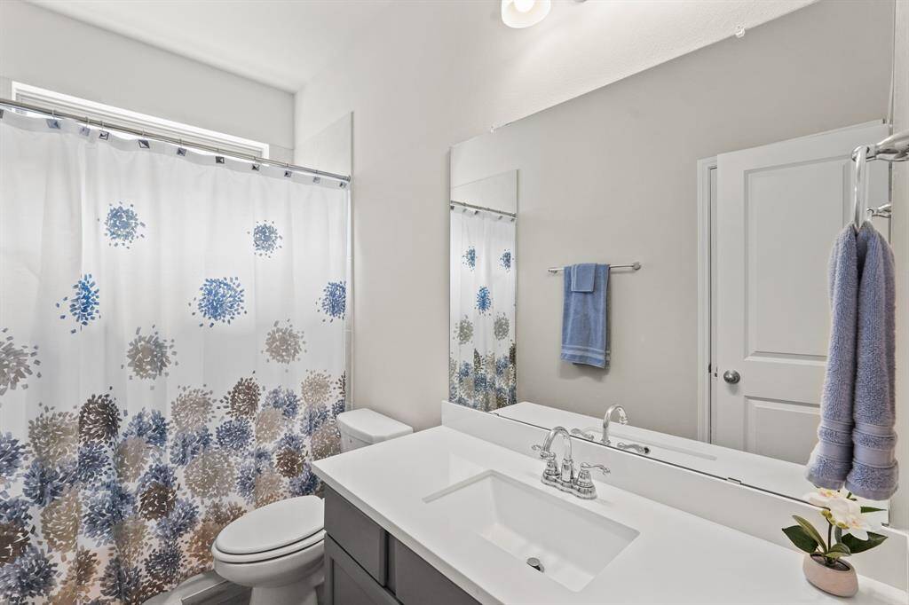 Secondary bathroom in hall with tub/shower combo PLUS linen closet