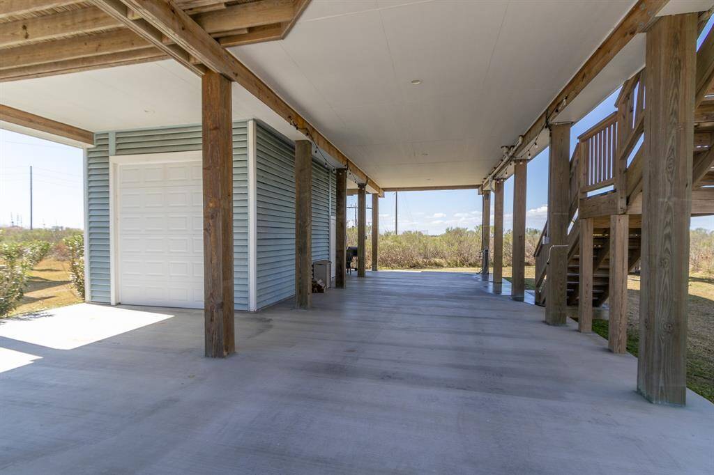 Downstairs, garage area for golf cart, beach chairs, etc.