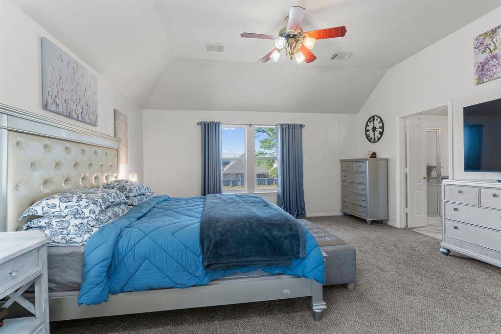 The primary suite boasts elegant high tray ceilings, adding a touch of sophistication!