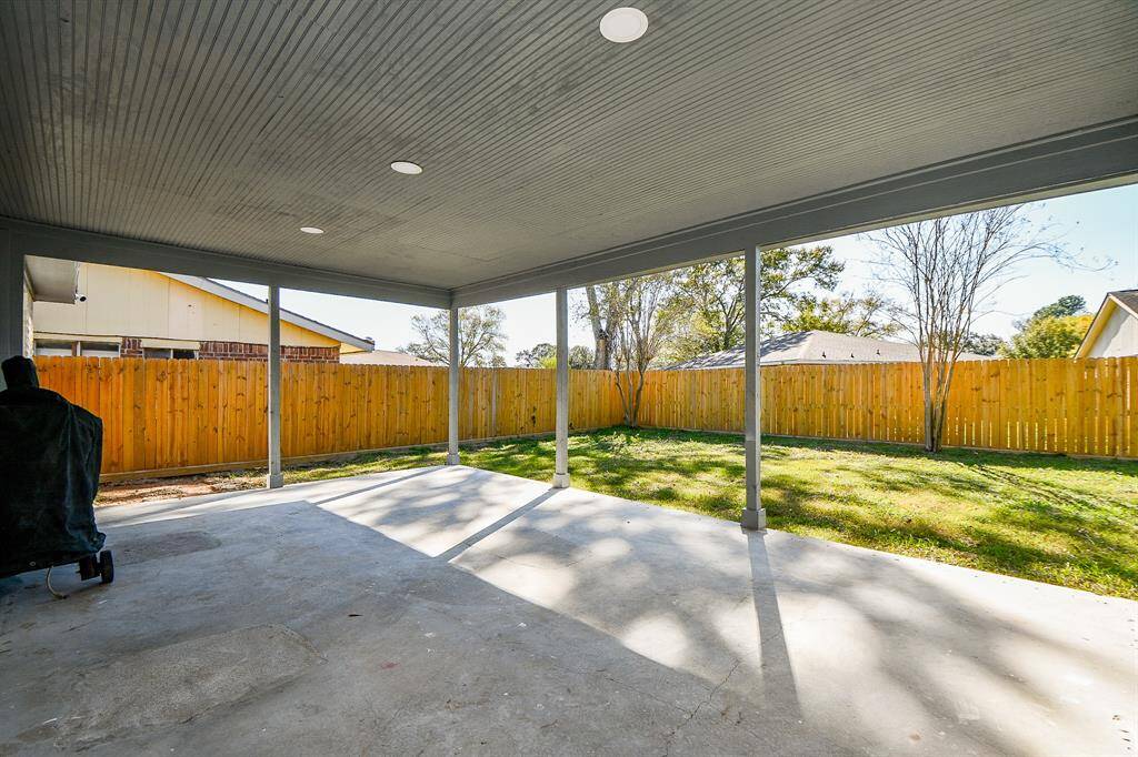 Get out from under the Texas sun, but still enjoy the great outdoors under this amazing covered patio!