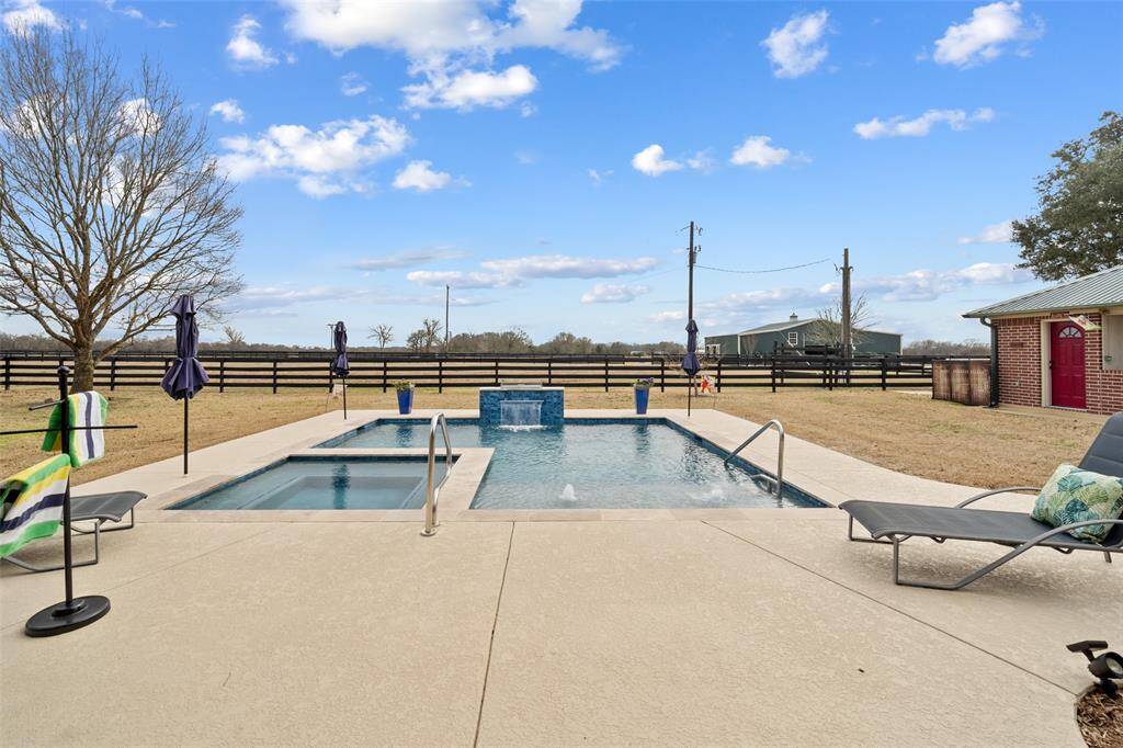 The amazing in ground pool and jacuzzi is perfect for entertainment and family time on a hot summer day!