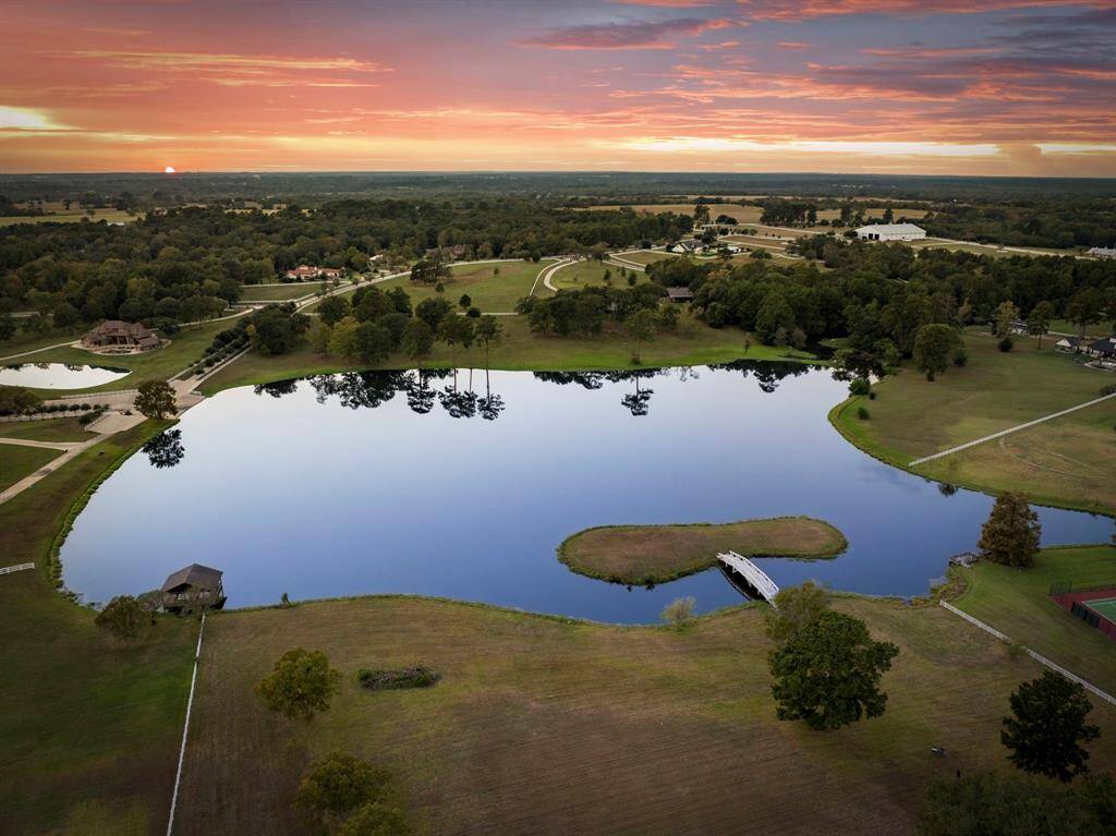 12 plus acres of land, nestled near whispering trees, overlooking a calm 14 acre lake and your own private island.