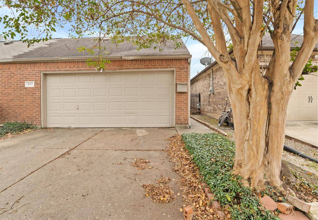 This beautiful home boasts a long driveway.