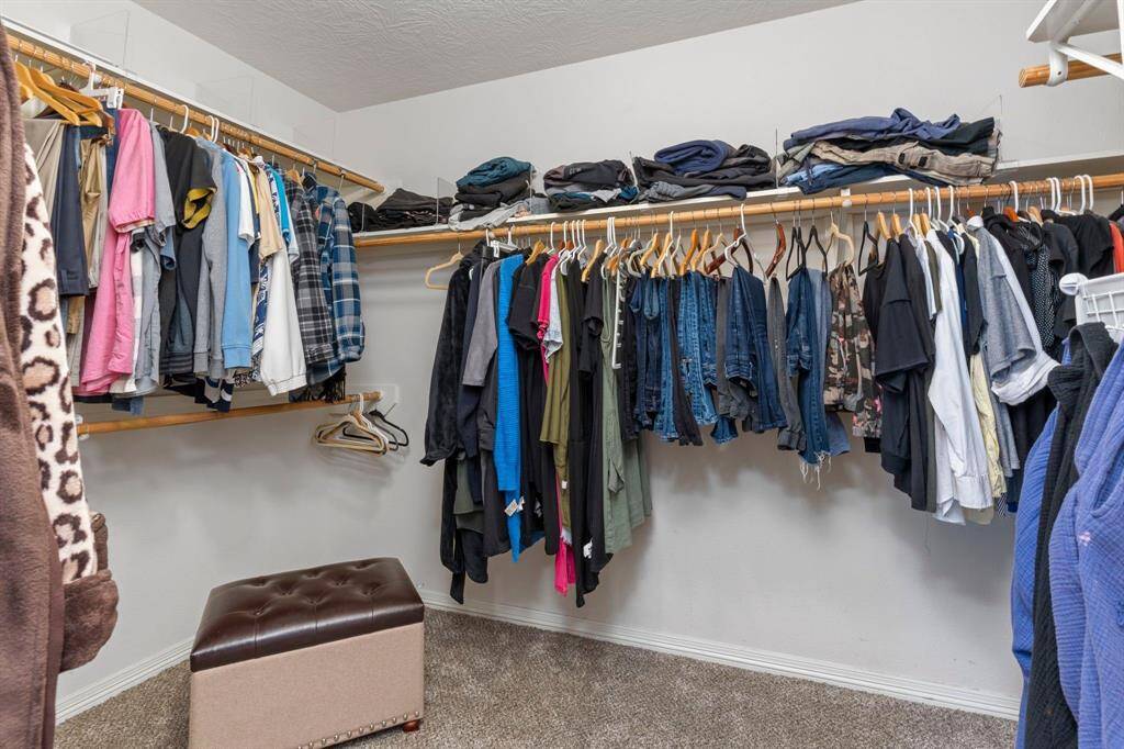This is just one section of the expansive walk-in closet—there’s so much more to discover!