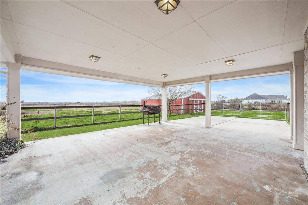 Back porch view of the acreage and barn