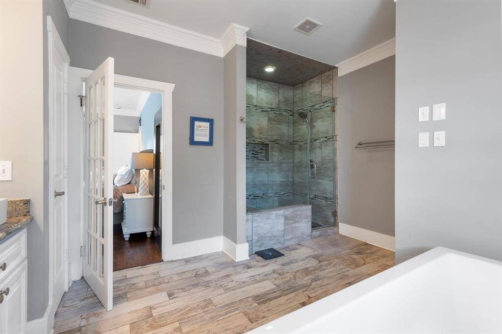 Walk in shower in primary bath room.