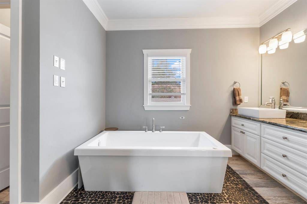 Another view of tub in primary bathroom.