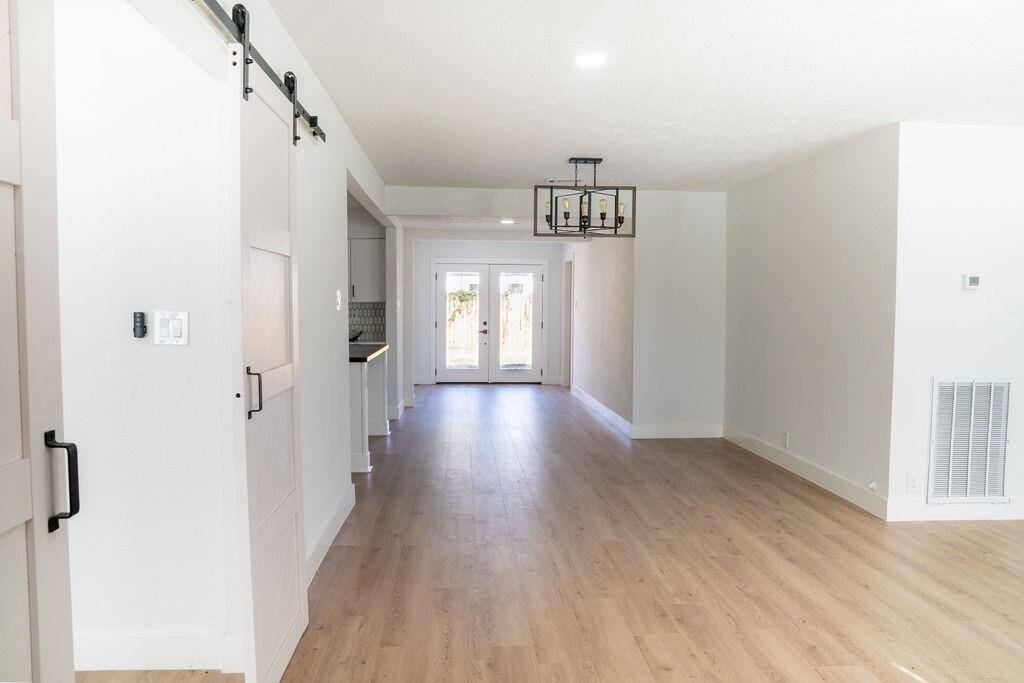 View from the entrance leading to the two-door backyard, offering easy access and natural light.