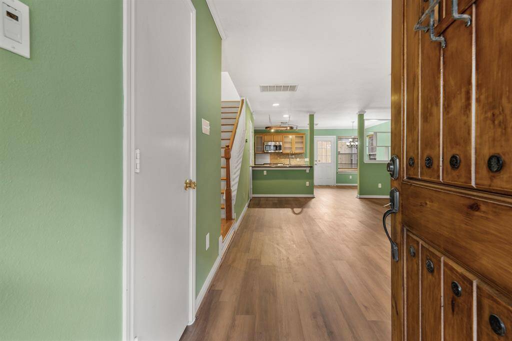 You'll be instantly greeted by beautiful wood floors, an incredible open floor plan and a charming staircase.