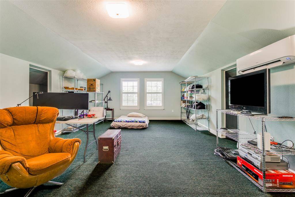 The over garage guest suite - perfect place for a game room/craft room or 6th bedroom - there is a lot of additional storage space.