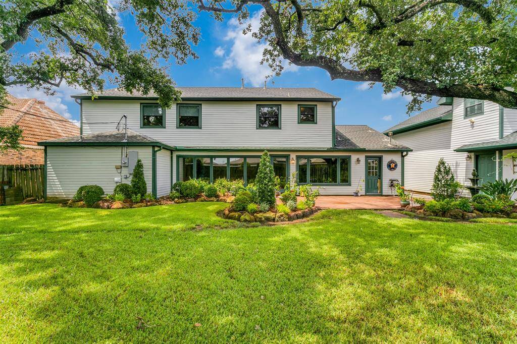 The backyard is nicely landscaped and has a large patio area - perfect for outdoor entertaining.