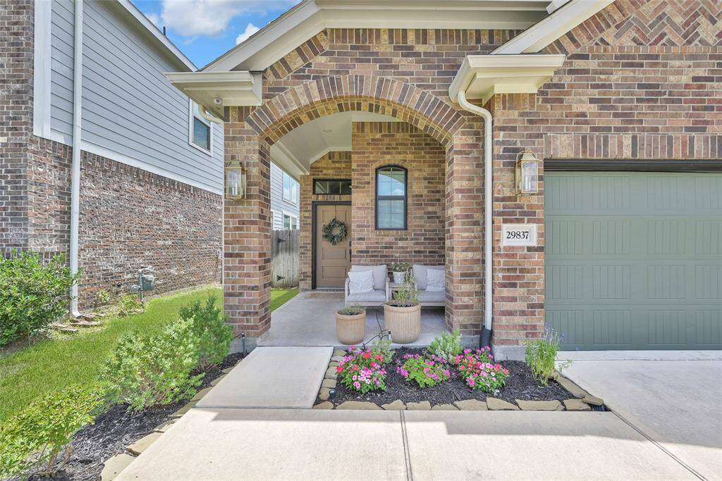 The charming front porch is the perfect spot to relax!