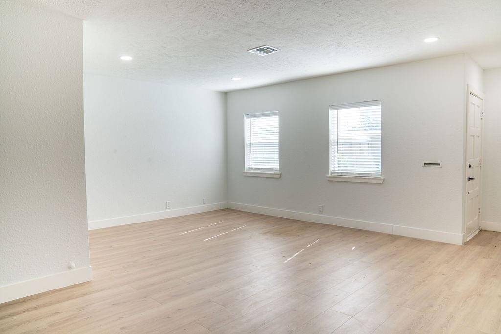 Bright living area at the front of the house, filled with natural light.