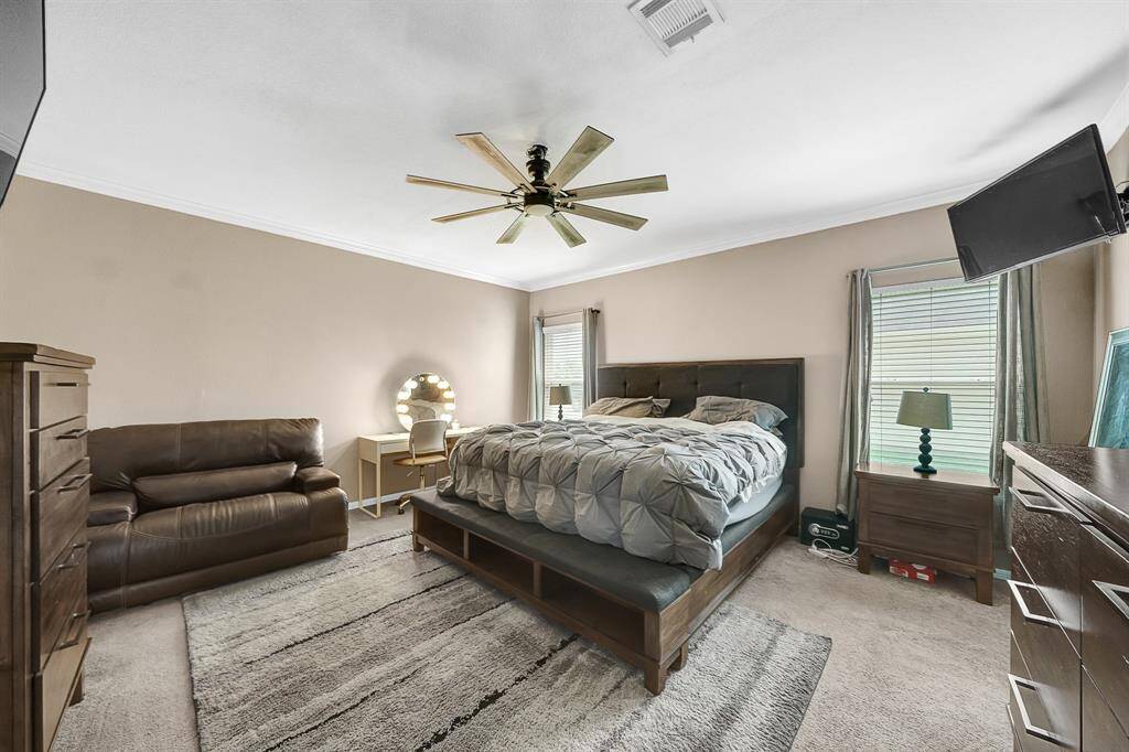 Spacious primary bedroom on the first floor with en-suite bath