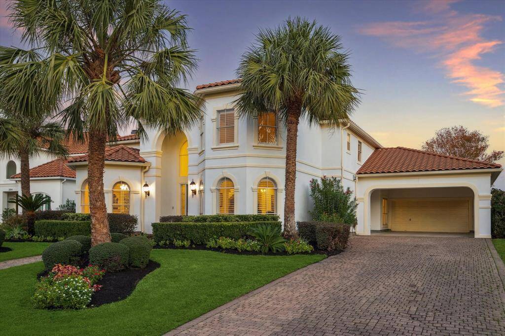 The residence features a spacious long double-wide side driveway offers a leading to a great convenient carport and the two-car garage, ensuring ample parking for residents and guests alike.