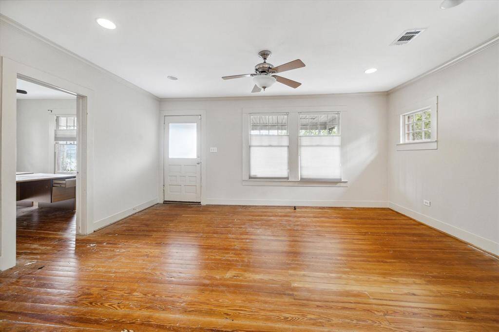 Front door opens into the light and bright living room, open floor plan to dining room and kitchen