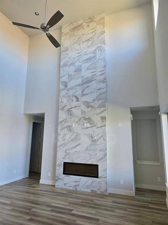 Modern Fireplace with Dramatic Tile to the Ceiling