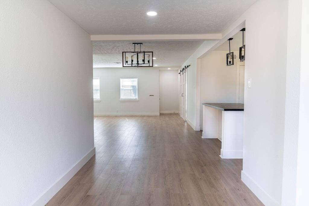 Spacious and bright open-concept living area with contemporary finishes, ideal for entertaining and family gatherings