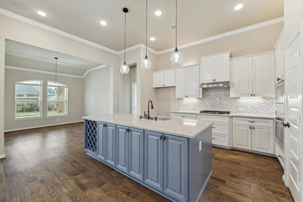 The kitchen opens directly to the Dining Room and the island has extra storage