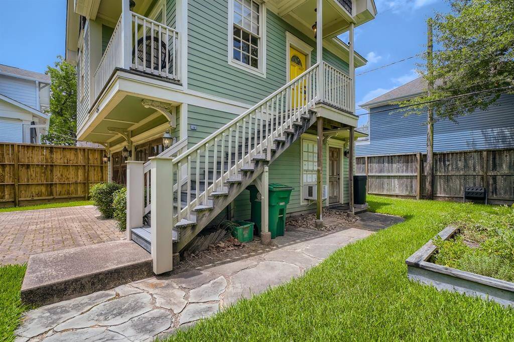 This charming home sits atop two garages and a laundry area.