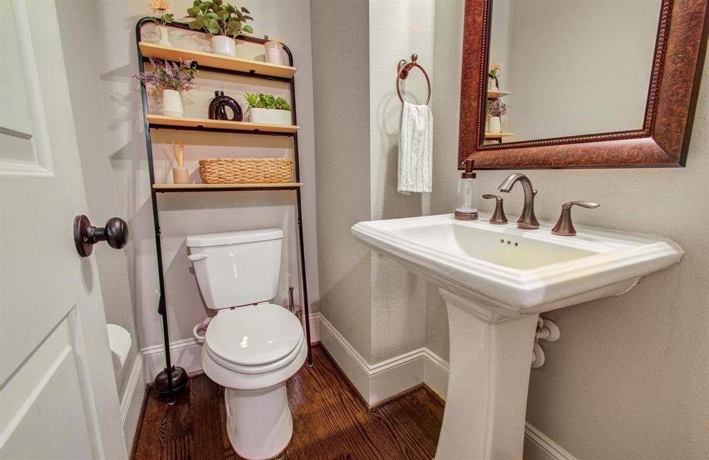 Half bath located at the top of the staircase