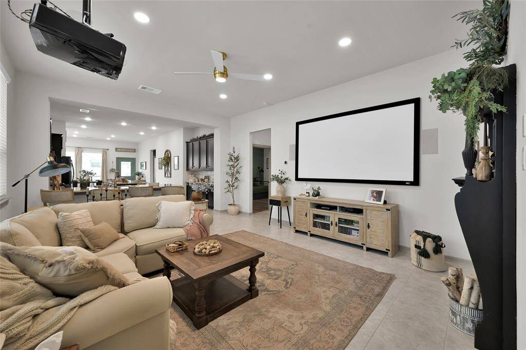 Spacious, modern living room witha neutral color scheme. *The media equipment (screen & projector) have been removed.