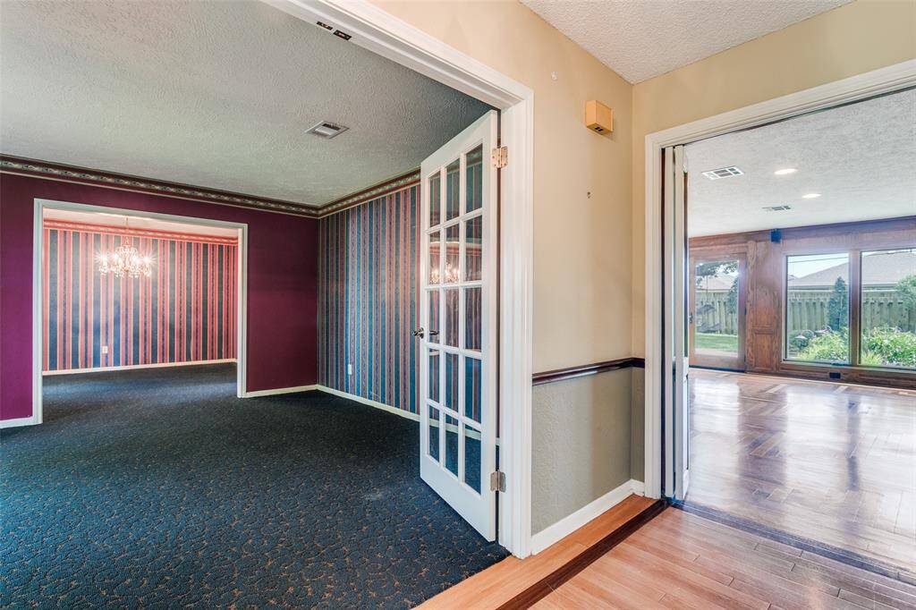 There are French doors leading into the formal living room. There are bi-fold doors leading to the family room.
