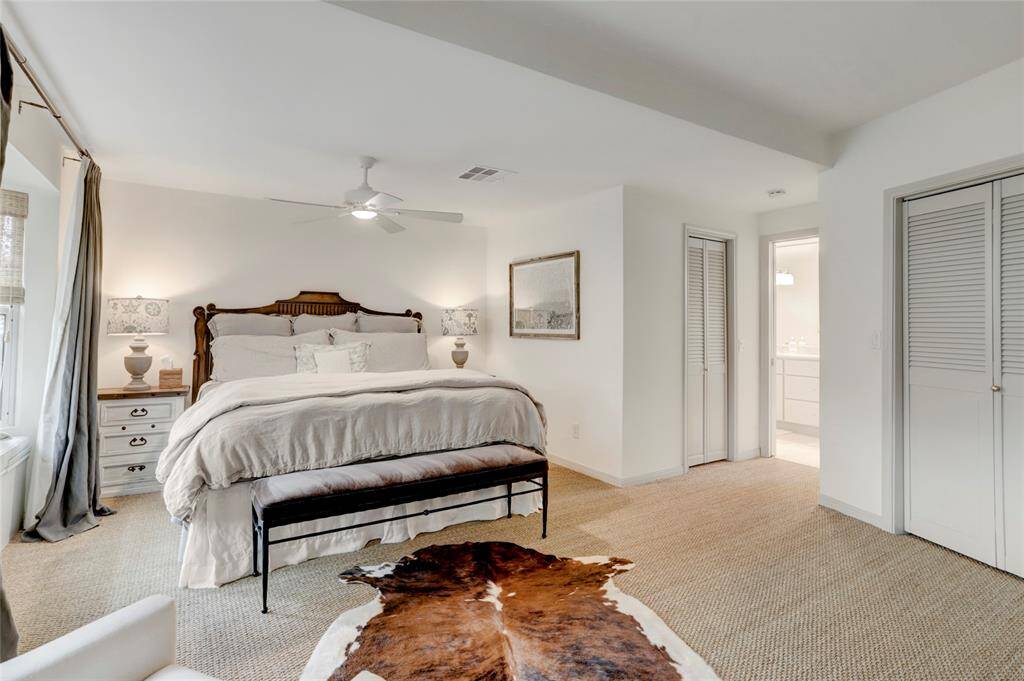 The sizable primary suite offers two walk-in closets and beautiful ensuite bath.