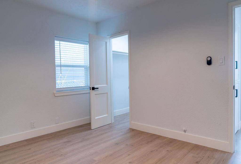 Spacious third bedroom with ample room for furniture and personalization.