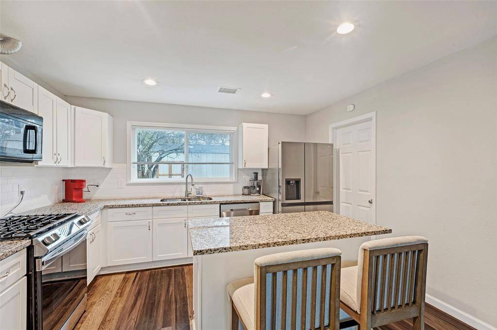 The kitchen island serves as a convenient breakfast bar