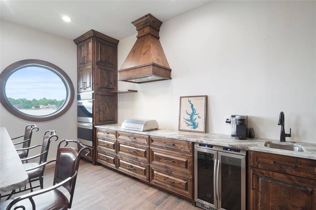 Entertaining is complete with inside grill with double ovens and wine fridge