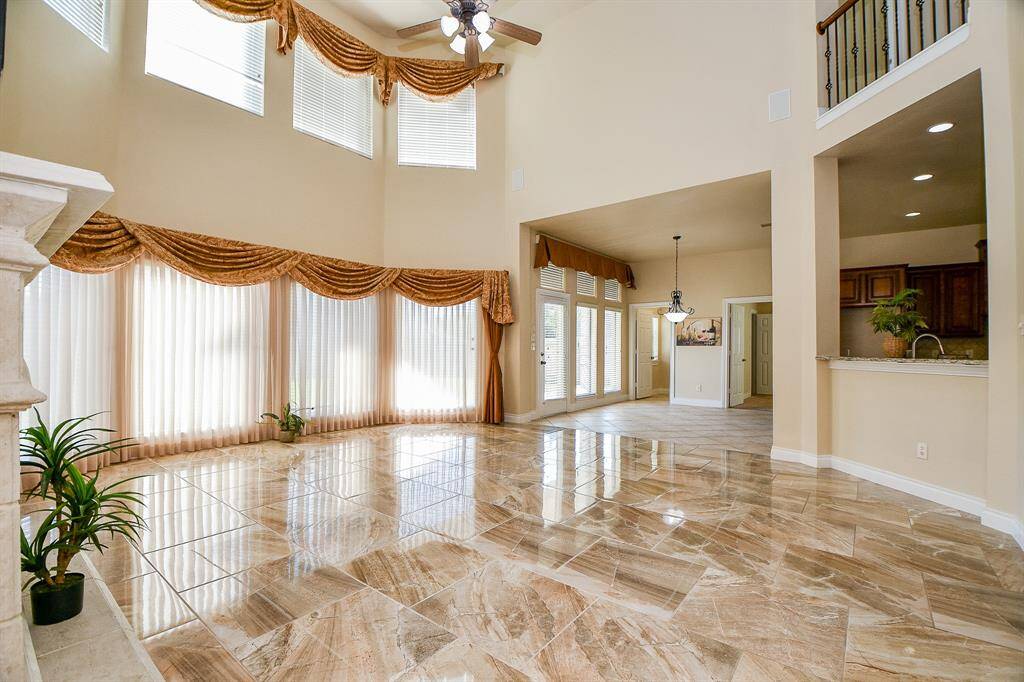 Huge den with lots of large windows creating plenty of natural lighting!