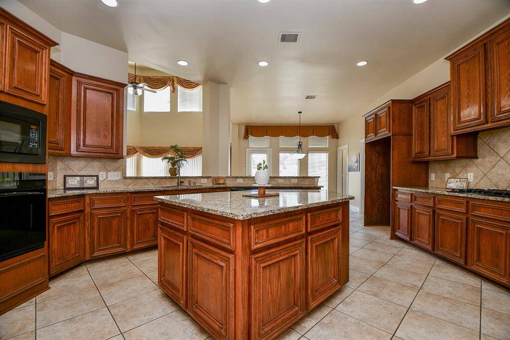 High ceilings and recessed lighting throughout the kitchen!