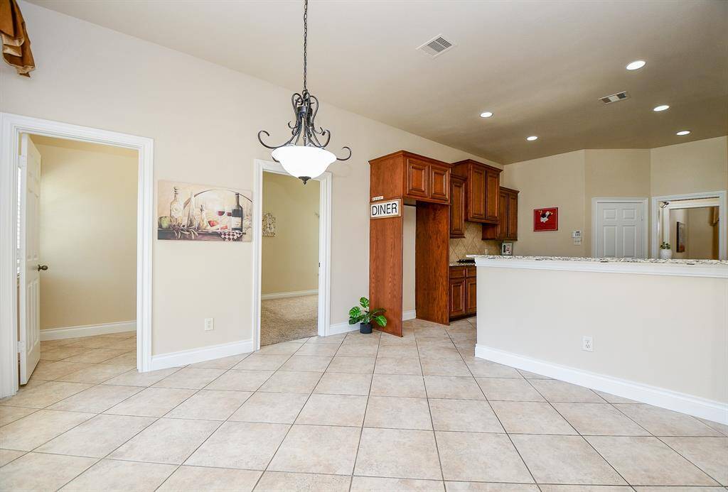 The breakfast area features tile floors and a chandelier!