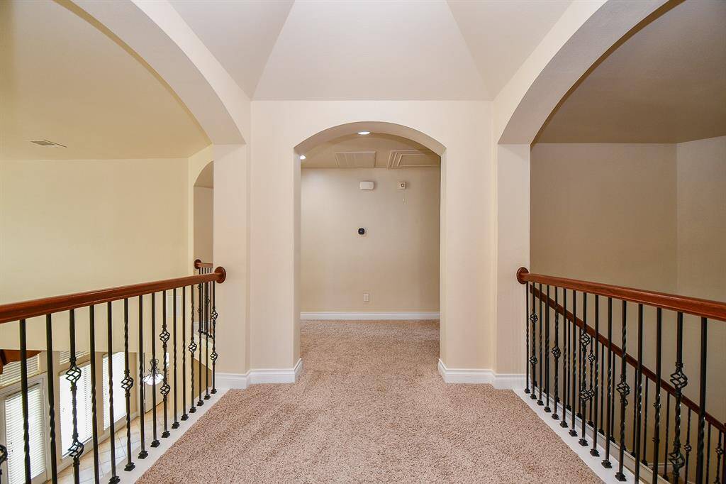View of the hallway connecting the two bedrooms upstairs to the gameroom area!