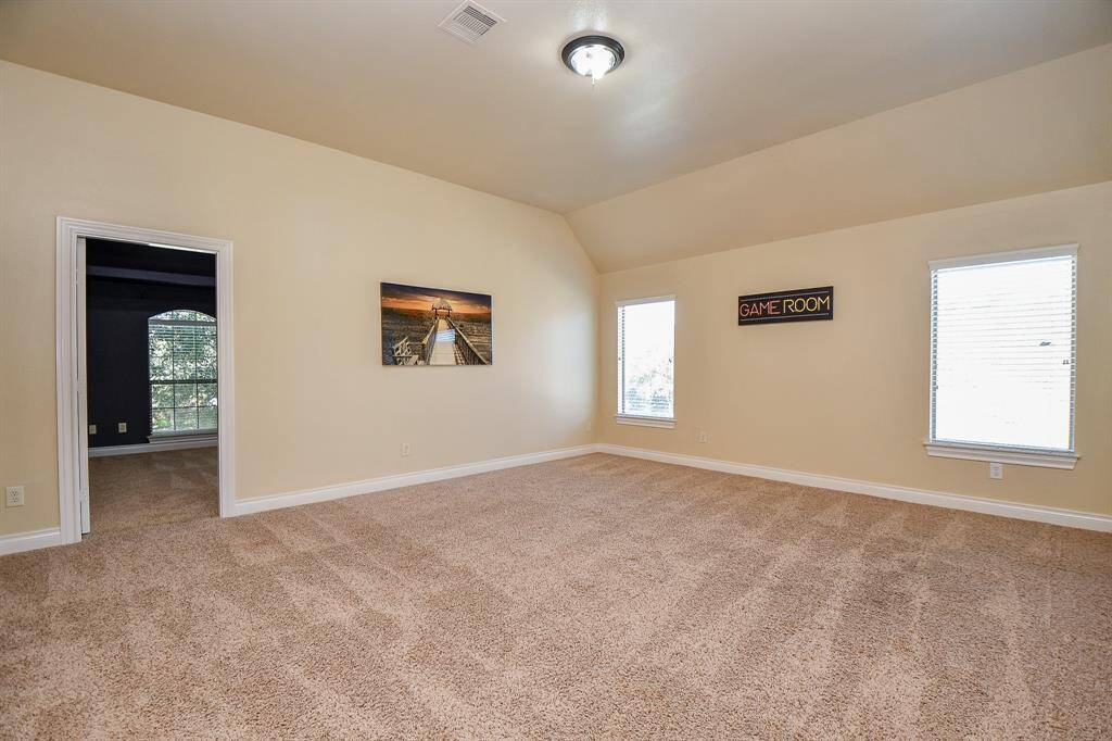 Another view of the large gameroom with the media room in the back!