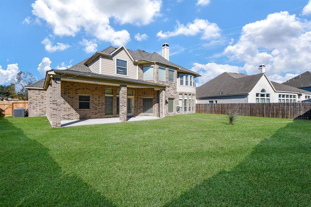 Large covered patio in the very spacious backyard!