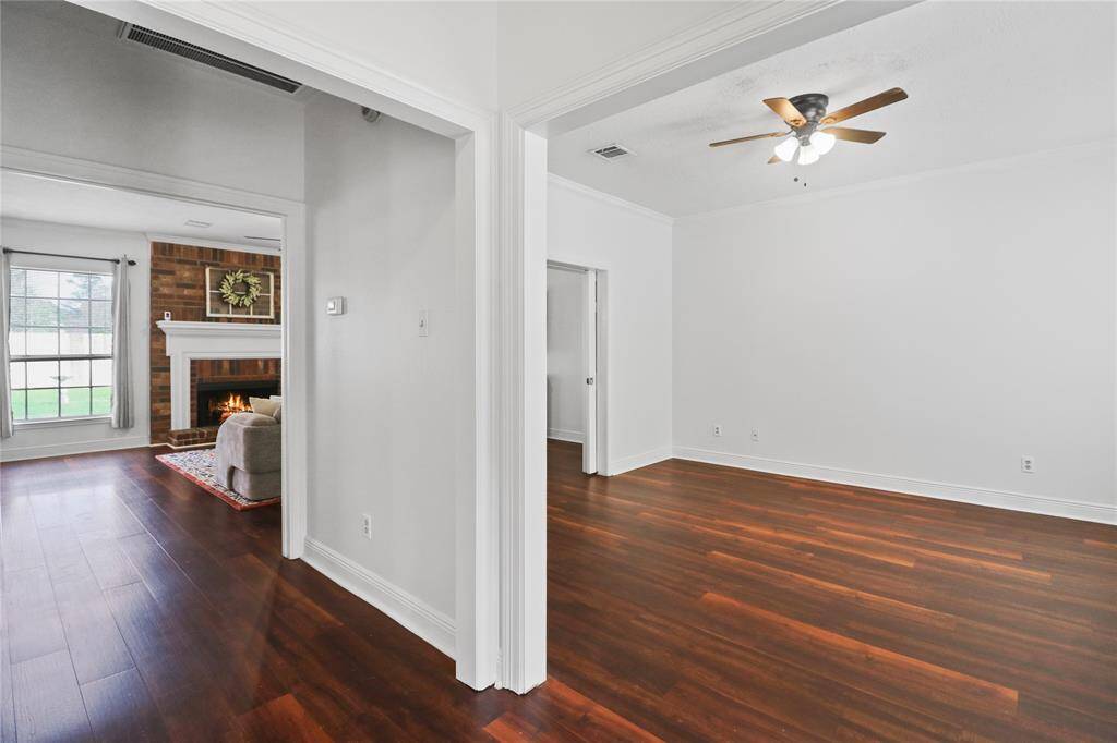 Elegant formal living room and cozy family space with a warm fireplace.