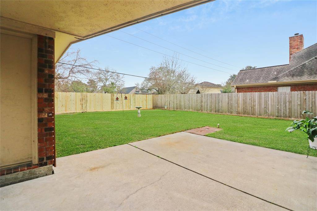 Enjoy easy access with a convenient covered walkway from the detached garage.
