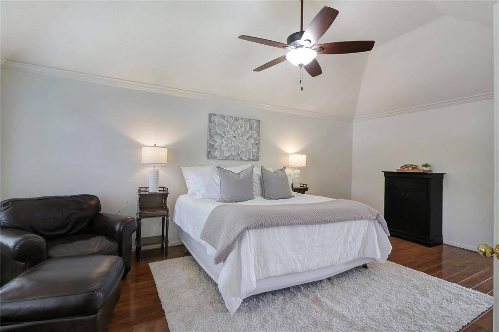 Primary bedroom has room for king size bed, sitting area and multiple dressers.