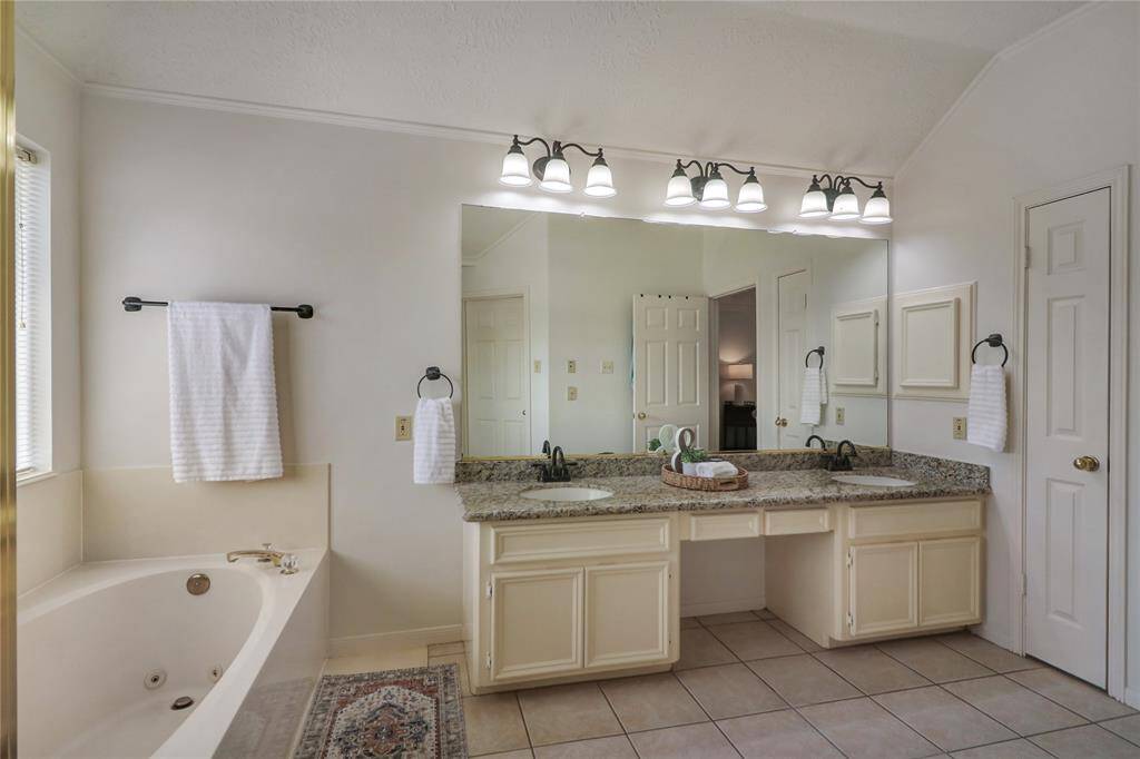Primary suite with separate tub and shower. As well as walk in closet.