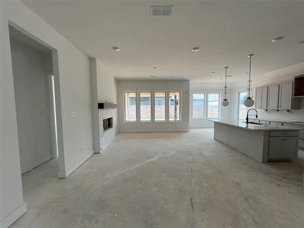 Naturally lit Family room with fireplace